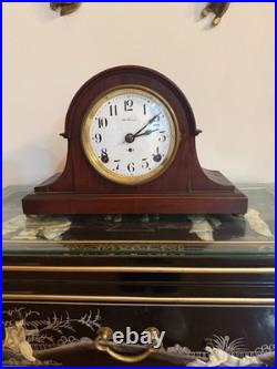 Antique Seth Thomas mantel clock with wood case and brass-tone bezel
