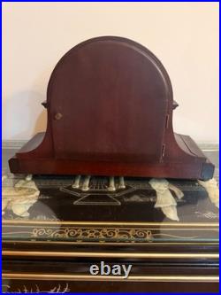 Antique Seth Thomas mantel clock with wood case and brass-tone bezel