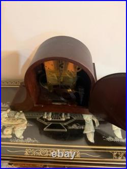 Antique Seth Thomas mantel clock with wood case and brass-tone bezel