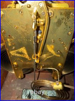 Antique Seth Thomas mantel clock with wood case and brass-tone bezel