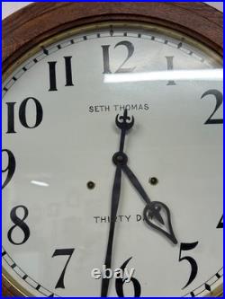 Antique restored 30 day Seth Thomas large oak arcade clock 23 in gallery lobby